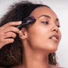 Girl using a Derma roller